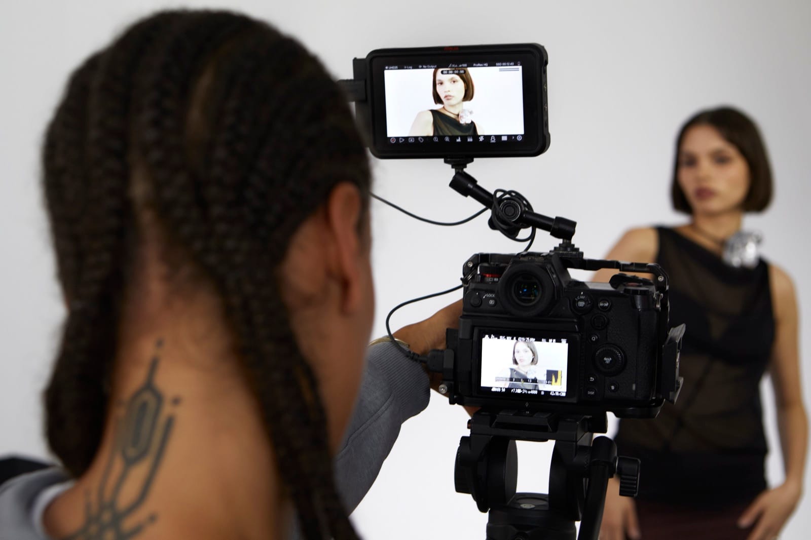A photographer checking a shot on the camera monitor mid-shoot